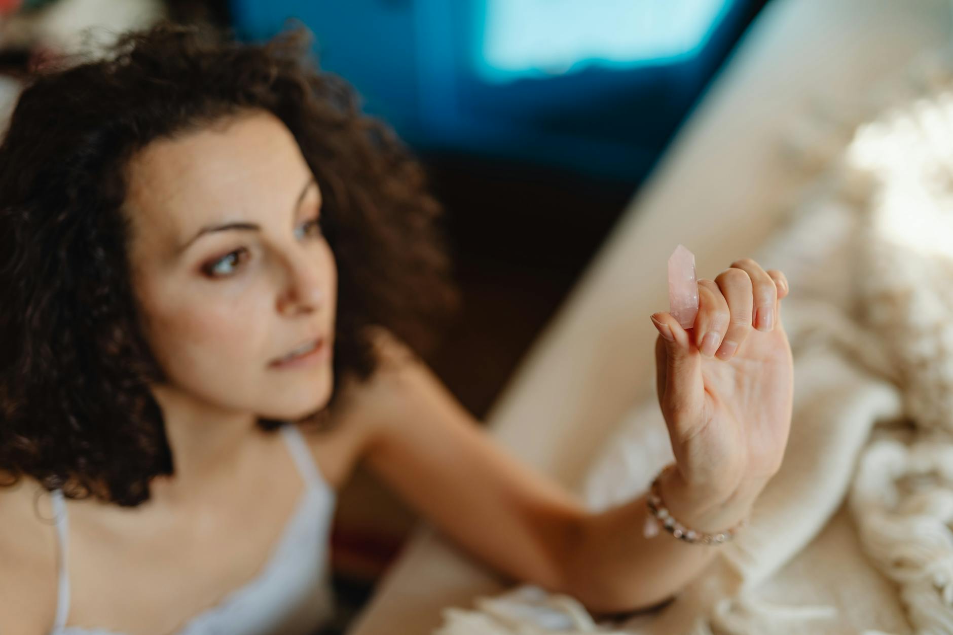 woman meditating with crystal